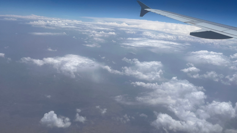 Aerial view of Delhi city seen from an airplane window during takeoff