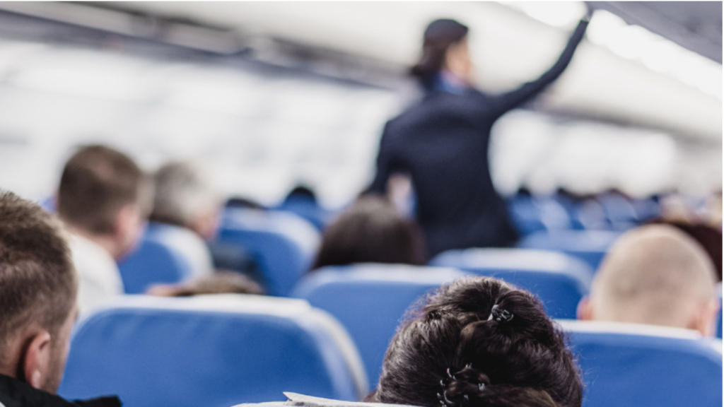 Inside an airplane cabin with passengers seated during a domestic flight