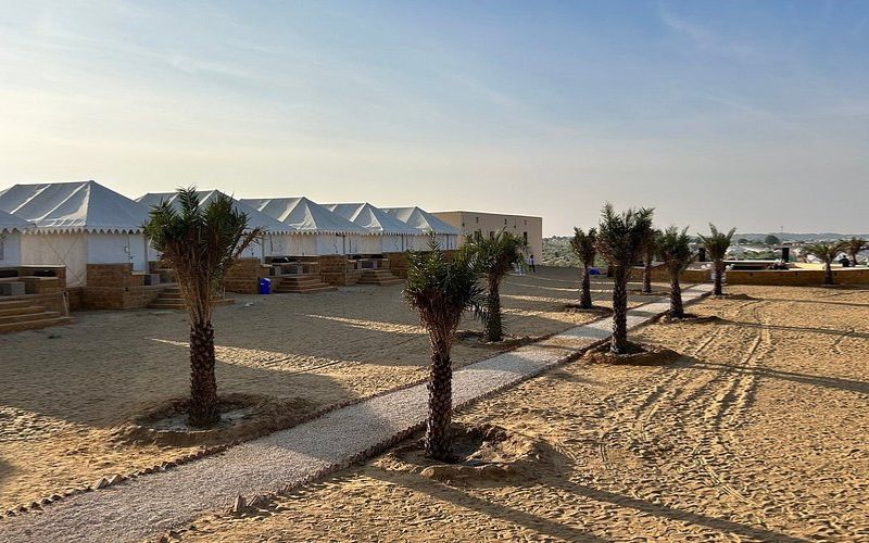 Desert camp tents near Sam Sand Dunes in Jaisalmer at sunset